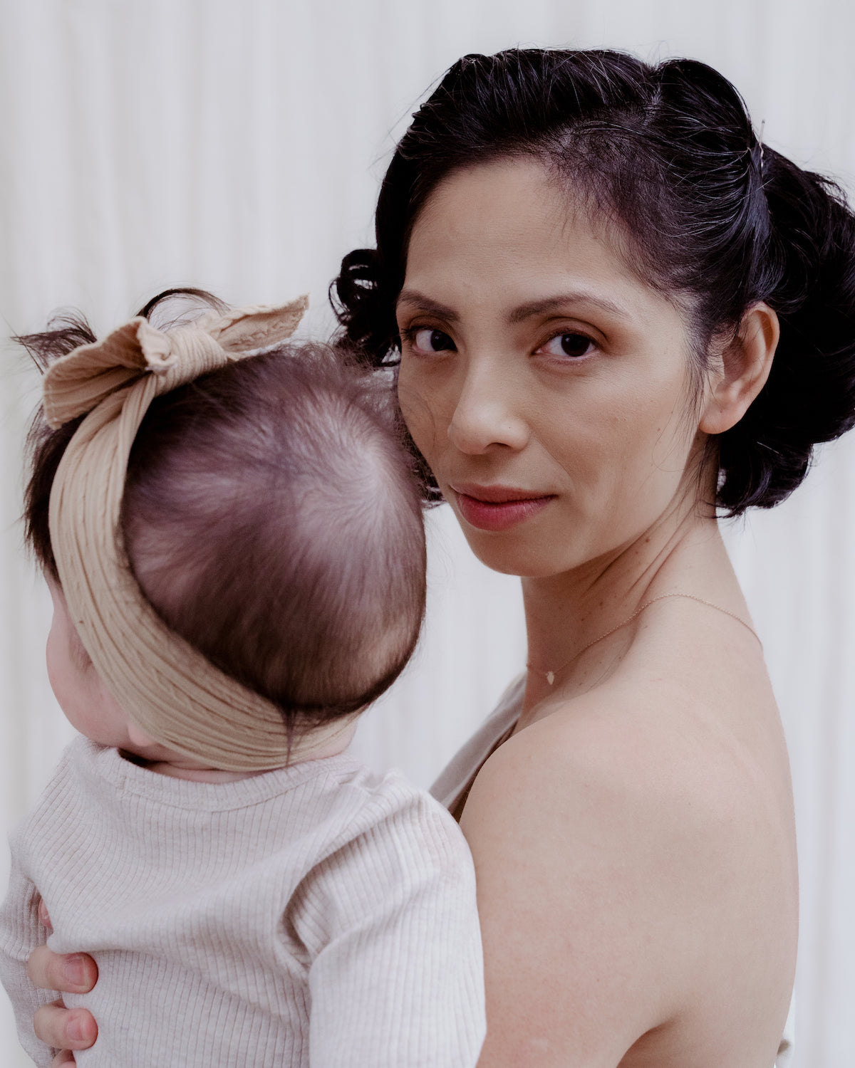 Newborn baby with new mother in mothers group 